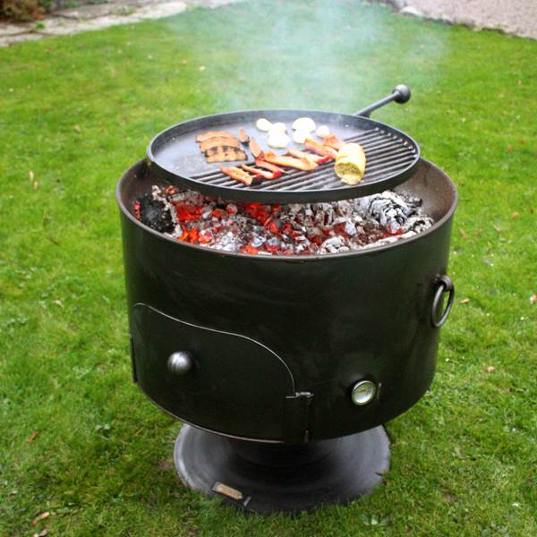 Pete's Oven Firepit 70cm - Manufactured from 3 – 4mm mild steel,  Pete’s Oven 70 includes a complimentary pizza stone, cutter and flat table top lid. The removable swing arm allows for further food items to be cooked simultaneously whilst the increased oven space can also be used for cooking chickens – not just limiting you to pizzas! For best results for the pizza oven, we would advise removing any leftover ash from the fire pit before cooking.   <strong>Material:</strong> 3 – 4mm Steel <strong>Size:</strong> 70cms Diameter x 23cms Depth. Total height including stand approx. 76cms (pit only) or approx. 80cms with the Swing Arm. The opening to the oven is approx. 36cm. The lid measures 10cm larger than the fire pit.