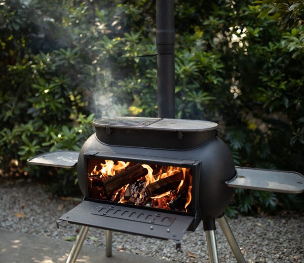 Ozpig Big Pig - <p class="x_gmail-p2">The Big Pig is a great heater, with the door open the heat from the fire within radiates directionally, so you can stay outside in comfort for longer. Being a wood fired stove, the Big Pig brings true versatility to your outdoor cooking setup. Used as a stove, you can cook any dish the same way you would on an indoor stove! The Big Pig really comes into its own with an open top design, letting you remove the stove top and cook directly over the wood fire, giving you the amazing flavour that only a wood fire can.<span class="x_gmail-Apple-converted-space"> </span></p>