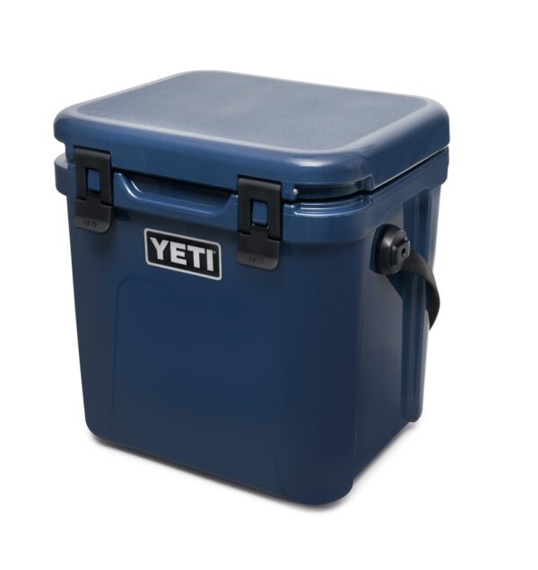 Yeti Roadie 24 - Navy - Yeti Roadie 24 - Navy The Roadie® 24 Hard Cooler is a fresh take on a tried-and-true YETI favourite. It’s 10% lighter weight, holds 20% more, and even performs 30% better thermally than its legendary predecessor. Plus, we built it tall enough to accommodate critical bottles of wine but slim enough to squeeze behind the driver’s or passenger’s seat of a car. Now that’s what we call a road trip buddy.