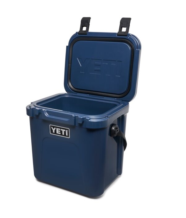 Yeti Roadie 24 - Navy - Yeti Roadie 24 - Navy The Roadie® 24 Hard Cooler is a fresh take on a tried-and-true YETI favourite. It’s 10% lighter weight, holds 20% more, and even performs 30% better thermally than its legendary predecessor. Plus, we built it tall enough to accommodate critical bottles of wine but slim enough to squeeze behind the driver’s or passenger’s seat of a car. Now that’s what we call a road trip buddy.
