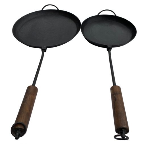 Fire Pit Long Handled Pan - Fire Pit Long Handled Pan These versatile long handled pans come in two sizes and are an essential piece of equipment for the fire pit cook. <div id="info"> The Firepits UK Long Handled Pan is highly versatile and can be used with both our fire pits and chimineas; simply place on the BBQ Rack. Made from mild steel they can be used for frying, griddling, sautéing and one pot dishes such as paella. The long wooden handle provides protection from the fire. </div> <h3><strong>Maintaining your fire pit</strong></h3> <strong>NB: All our fire pits, lids and accessories will begin to rust immediately and will not maintain their black finish. However, this will not affect their long term durability. As all our fire pits are handmade from sheet steel which has naturally occurring blemishes, there may be very slight variations in the forging and finish. </strong>